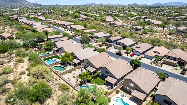 4426 E Coyote Wash Dr, Cave Creek, AZ 85331 - aerial perspective of suburban area with a pool area and a mountainous background