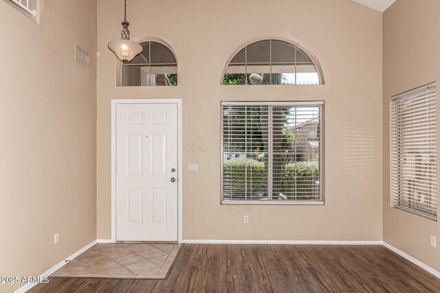 4426 E Coyote Wash Dr, Cave Creek, AZ 85331 - entryway with wood finished floors, a towering ceiling, and baseboards