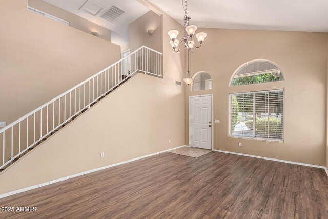 4426 E Coyote Wash Dr, Cave Creek, AZ 85331 - foyer featuring wood finished floors, a chandelier, stairway, high vaulted ceiling, and baseboards