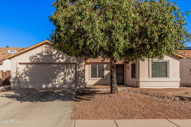 obstructed view of property with a garage