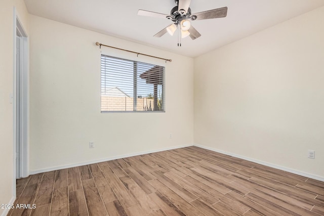 empty room featuring ceiling fan and light wood-type flooring