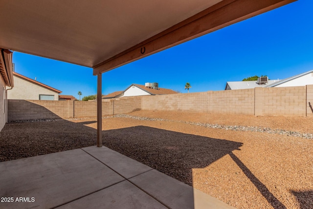 view of yard with a patio and central AC unit