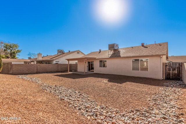 back of property featuring a patio and central air condition unit