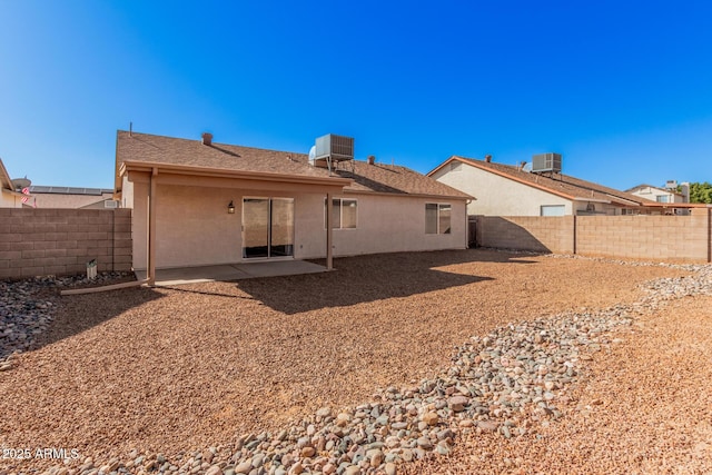 rear view of property featuring a patio area and central air condition unit