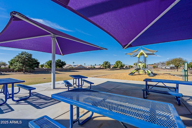 view of swimming pool featuring a playground