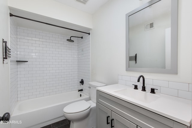 full bathroom with toilet, vanity, visible vents,  shower combination, and tasteful backsplash