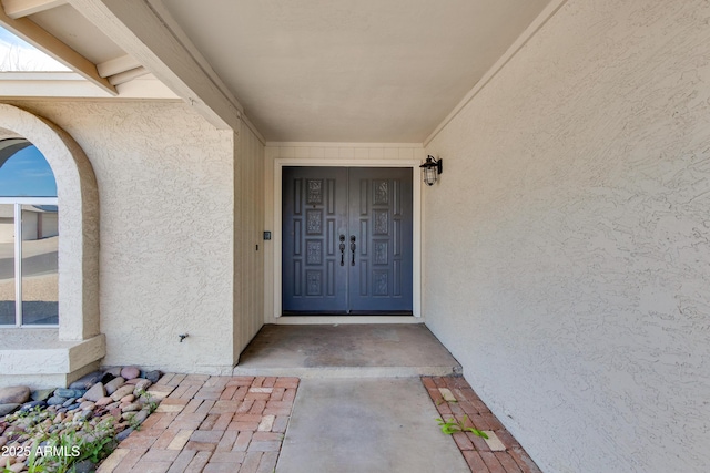 doorway to property with stucco siding