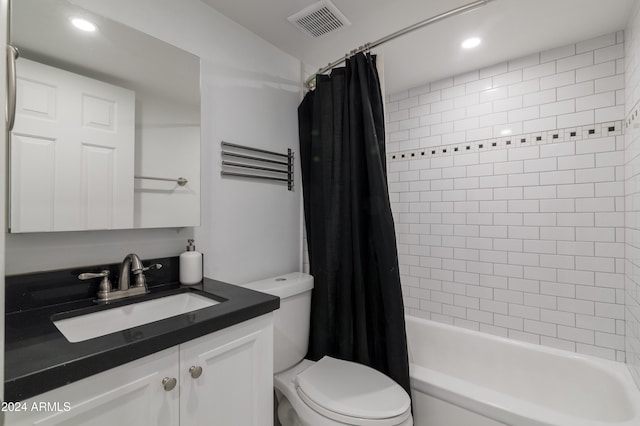 full bathroom with vanity, shower / bathtub combination with curtain, and toilet