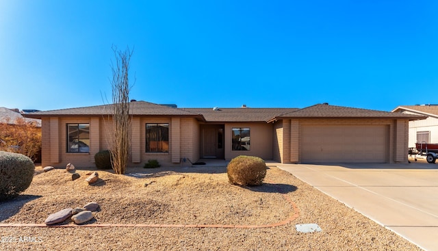 ranch-style house featuring a garage