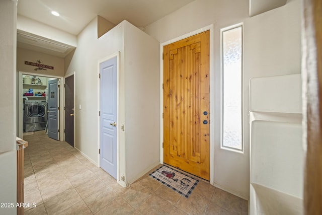 foyer featuring light tile patterned floors and baseboards