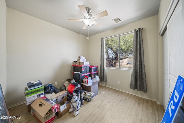 interior space with visible vents and a ceiling fan