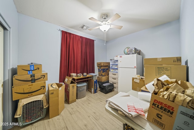 storage area featuring visible vents and a ceiling fan