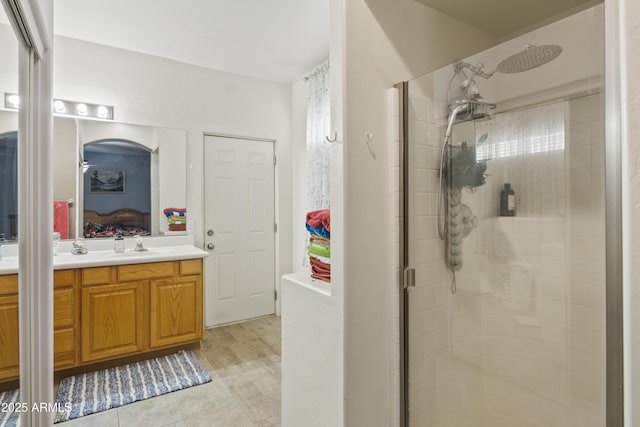 bathroom featuring vanity and a stall shower