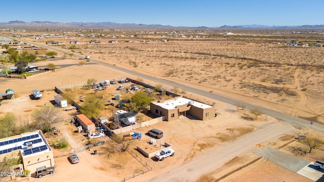 birds eye view of property with view of desert, a rural view, and a mountain view