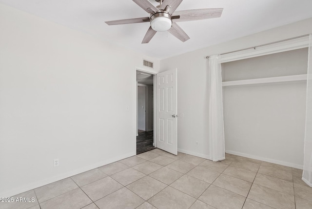 1160 E Hampton Cir, Mesa, AZ 85204 - unfurnished bedroom with light tile patterned flooring, a closet, and a ceiling fan