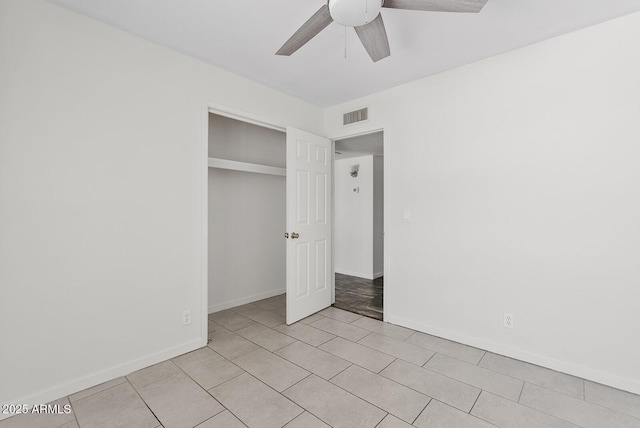 1160 E Hampton Cir, Mesa, AZ 85204 - unfurnished bedroom featuring a closet, ceiling fan, and light tile patterned floors