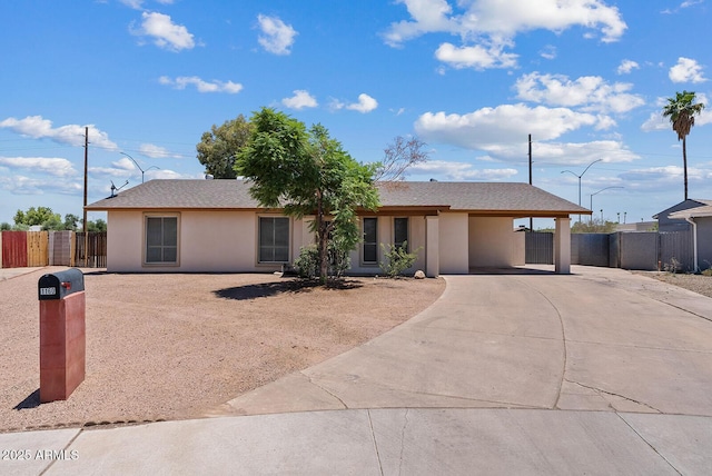 1160 E Hampton Cir, Mesa, AZ 85204 - ranch-style home with driveway, stucco siding, and a carport