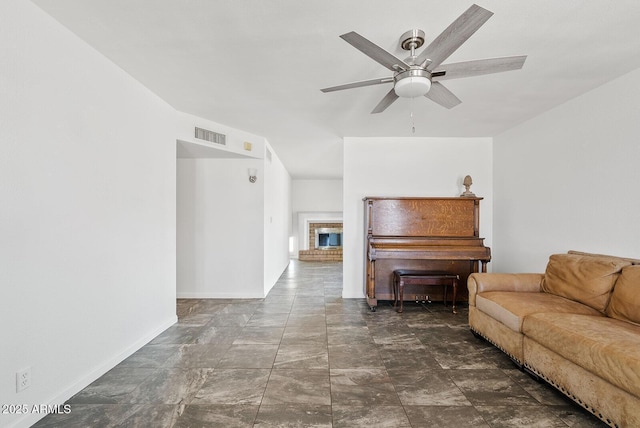 1160 E Hampton Cir, Mesa, AZ 85204 - living area featuring a ceiling fan and a brick fireplace