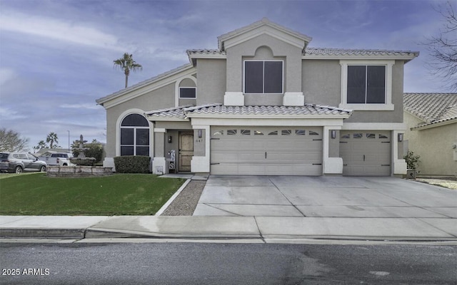 view of front facade featuring a garage and a front lawn