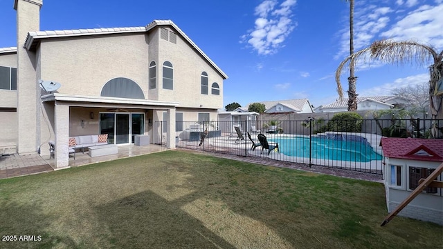 view of pool with a yard and a patio