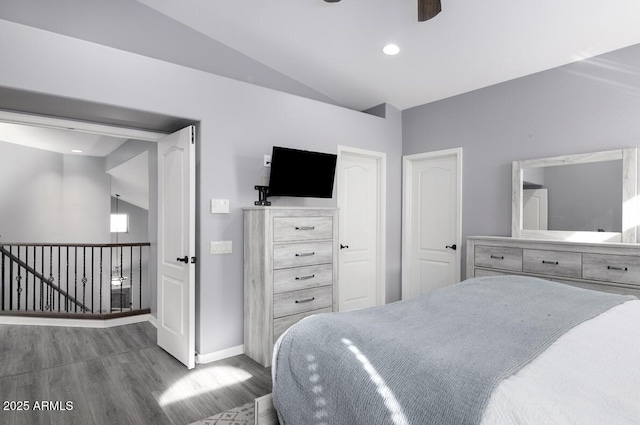 bedroom featuring ceiling fan, vaulted ceiling, and hardwood / wood-style floors