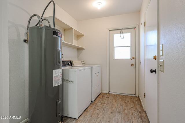 laundry room featuring separate washer and dryer, light hardwood / wood-style floors, and water heater