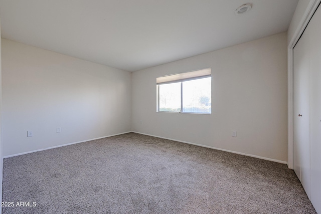 spare room featuring carpet floors