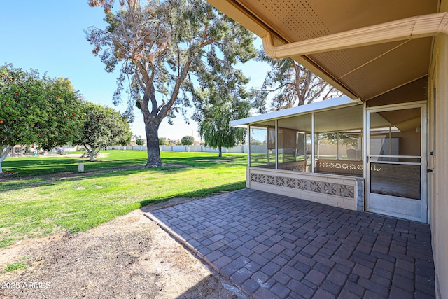 view of patio with a sunroom