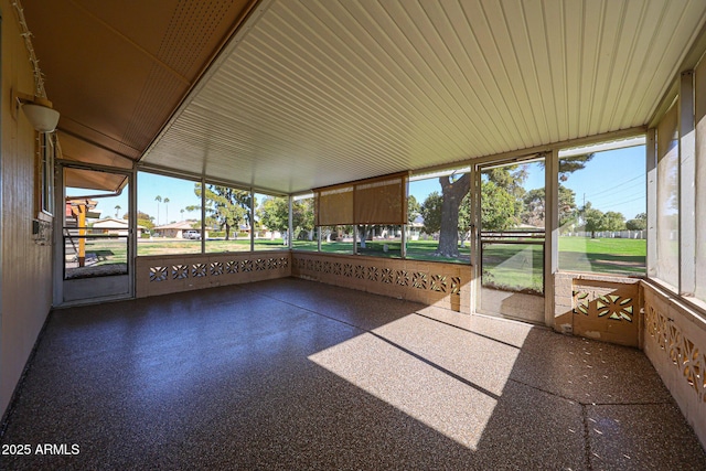 unfurnished sunroom with plenty of natural light