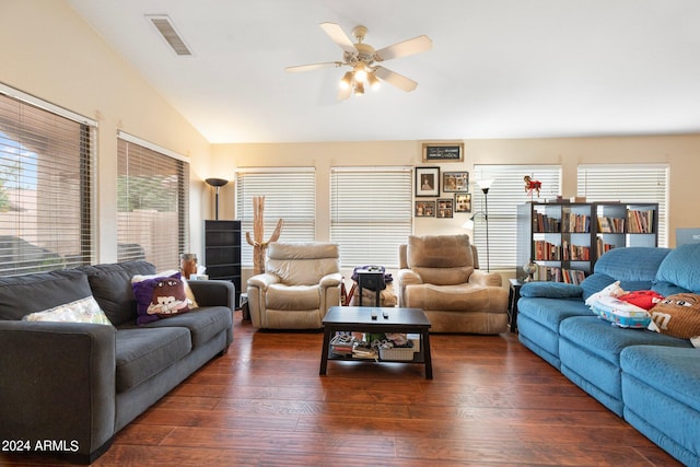 living room featuring ceiling fan, dark wood-type flooring, and vaulted ceiling