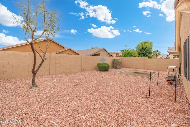 view of yard featuring a patio area and a fenced backyard