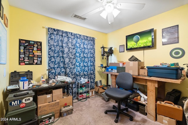 carpeted home office featuring visible vents and a ceiling fan