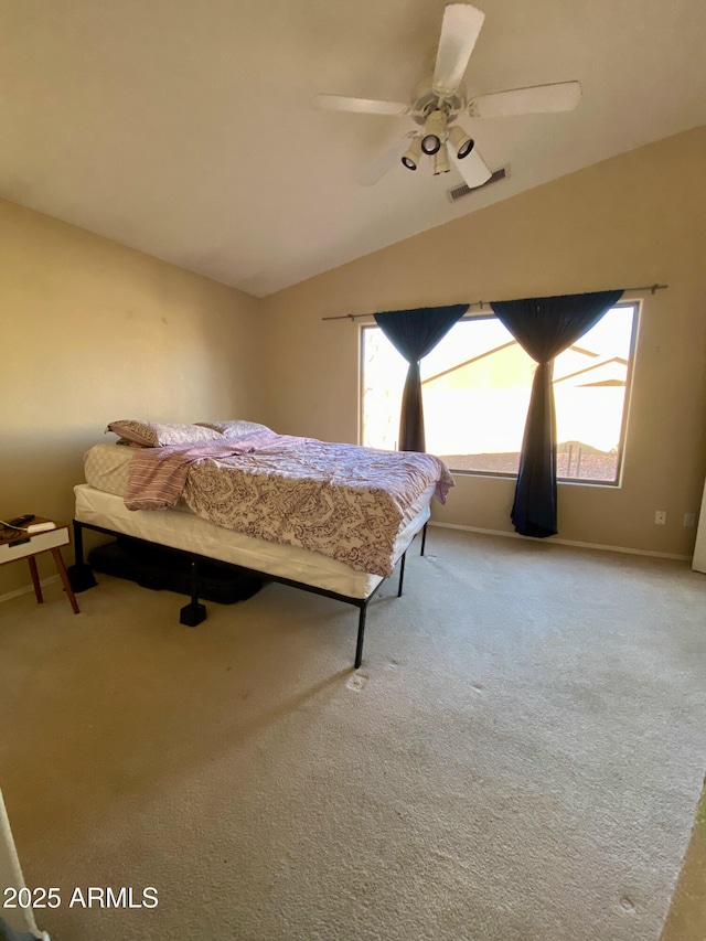 carpeted bedroom featuring ceiling fan and lofted ceiling