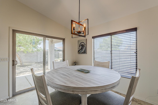16523 W Desert Bloom St, Goodyear, AZ 85338 - dining area with a chandelier, lofted ceiling, and light tile patterned floors