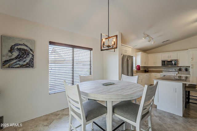 16523 W Desert Bloom St, Goodyear, AZ 85338 - dining area with vaulted ceiling and a chandelier