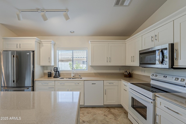 16523 W Desert Bloom St, Goodyear, AZ 85338 - kitchen with stainless steel appliances, white cabinetry, and light countertops