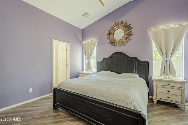 16523 W Desert Bloom St, Goodyear, AZ 85338 - bedroom featuring lofted ceiling and wood finished floors