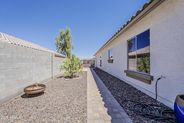 16523 W Desert Bloom St, Goodyear, AZ 85338 - fenced backyard with a fire pit