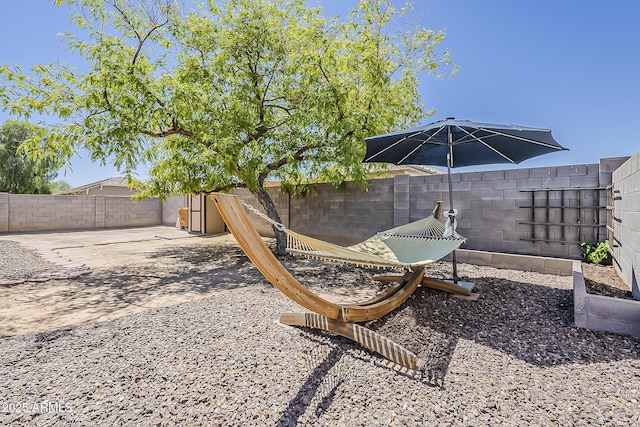 16523 W Desert Bloom St, Goodyear, AZ 85338 - fenced backyard with a patio
