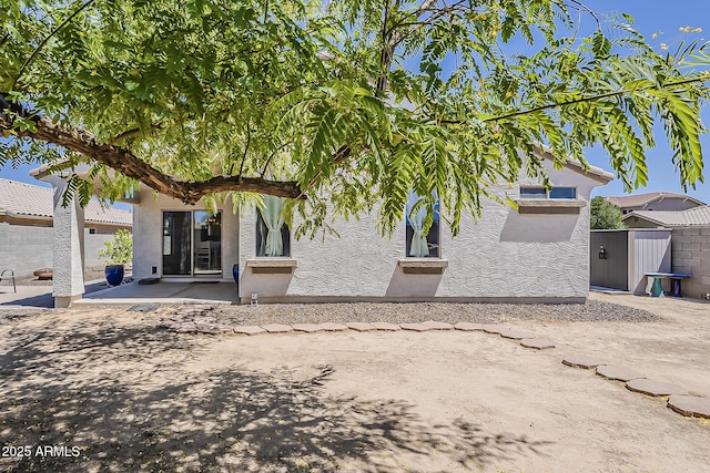 16523 W Desert Bloom St, Goodyear, AZ 85338 - back of property with a patio area and stucco siding