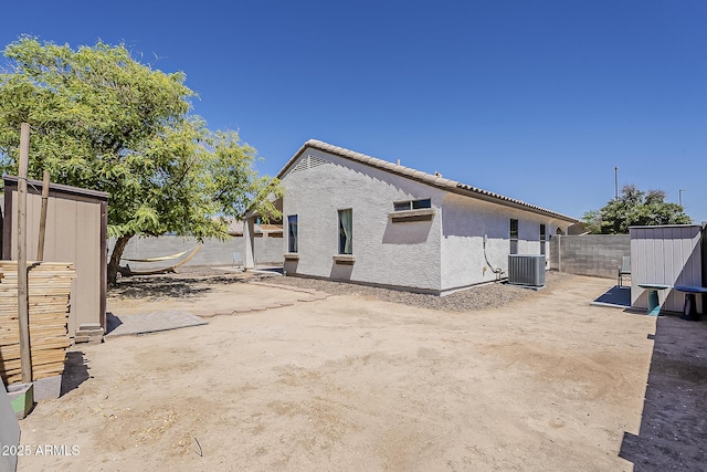 16523 W Desert Bloom St, Goodyear, AZ 85338 - back of house with stucco siding and a fenced backyard