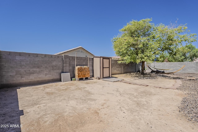 16523 W Desert Bloom St, Goodyear, AZ 85338 - fenced backyard featuring a storage shed