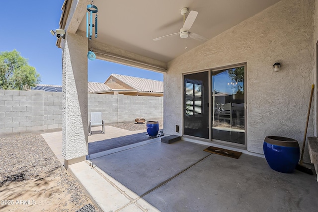 16523 W Desert Bloom St, Goodyear, AZ 85338 - fenced backyard with a ceiling fan and a patio area