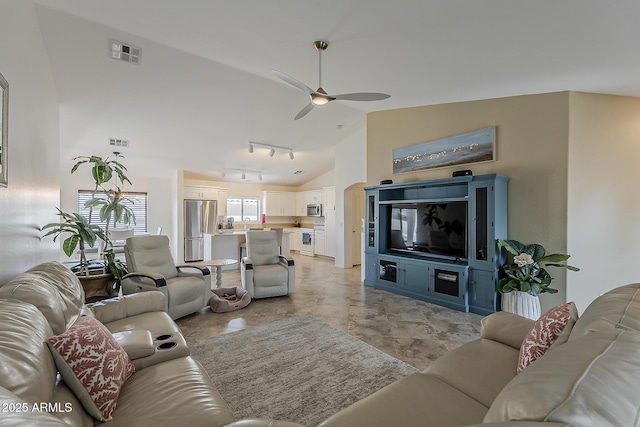 16523 W Desert Bloom St, Goodyear, AZ 85338 - living area featuring ceiling fan, track lighting, and high vaulted ceiling