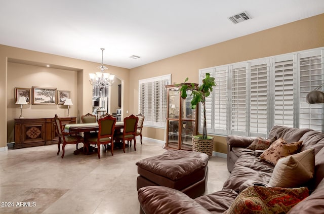 living room with a notable chandelier