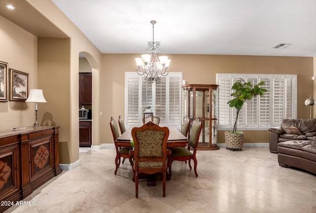 dining space with a chandelier