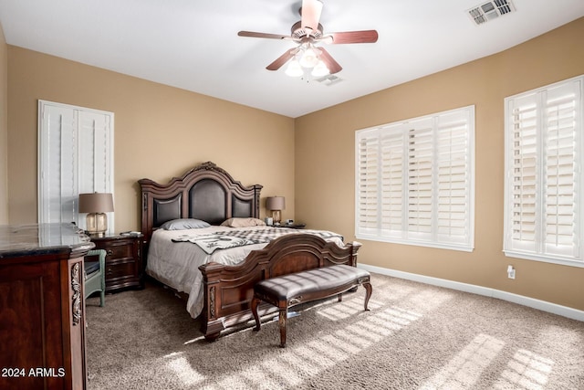 carpeted bedroom with ceiling fan