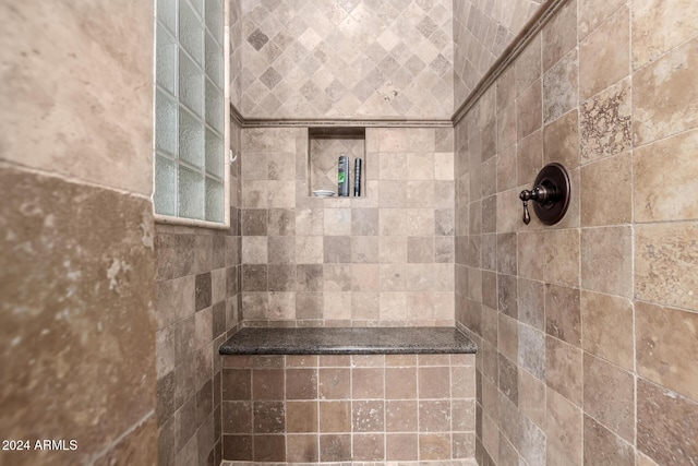 bathroom featuring tiled shower