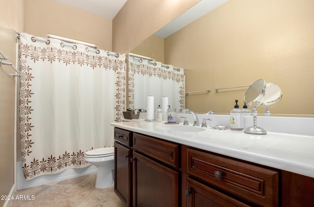 full bathroom featuring tile patterned flooring, vanity, toilet, and shower / bath combo