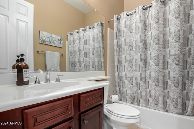 full bathroom with vanity, shower / bath combination with curtain, and toilet